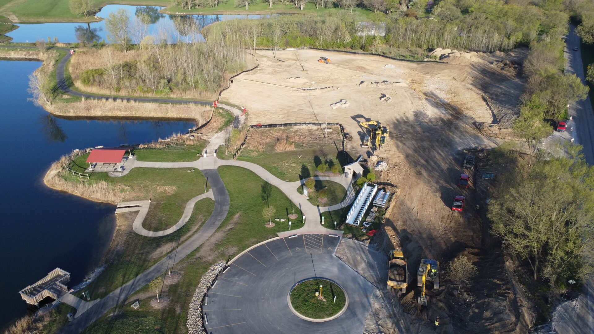 Aerial view of construction site near a scenic lake.