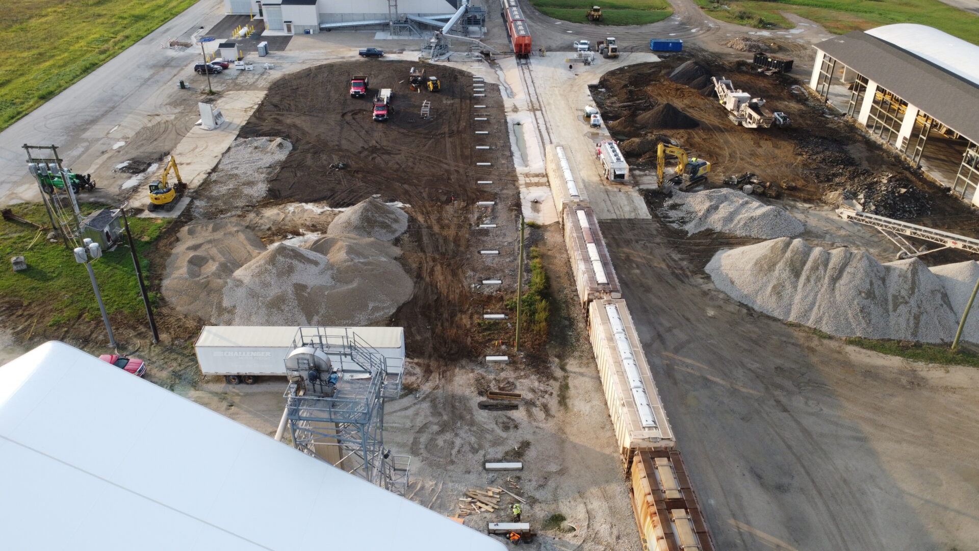Aerial view of industrial construction site with heavy machinery.